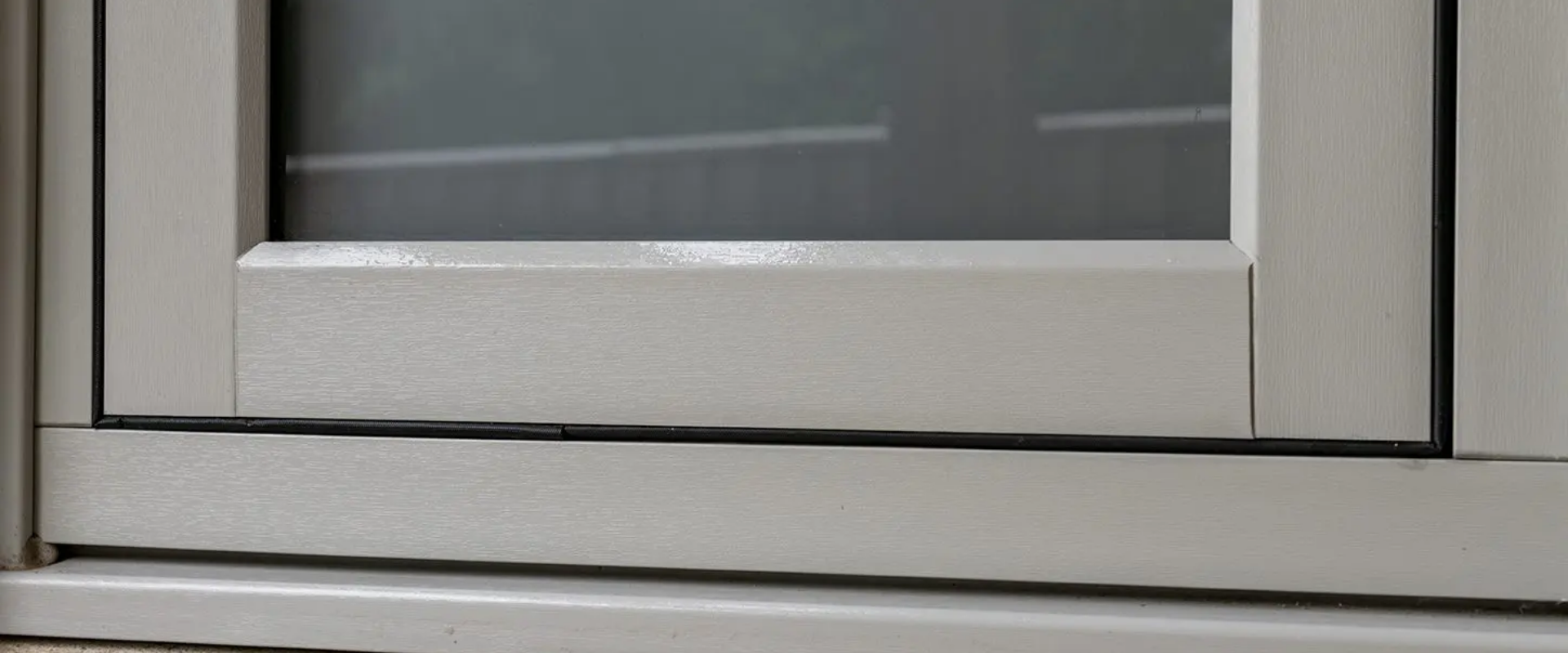 Close up view of white flush window seam