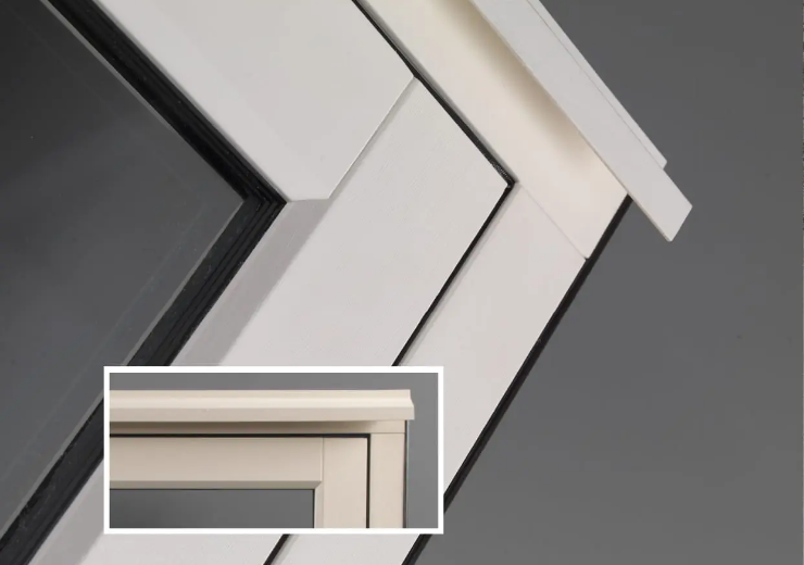 Close-up of a concealed trickle vent on a wood effect uPVC window, blending modern ventilation with traditional aesthetics.