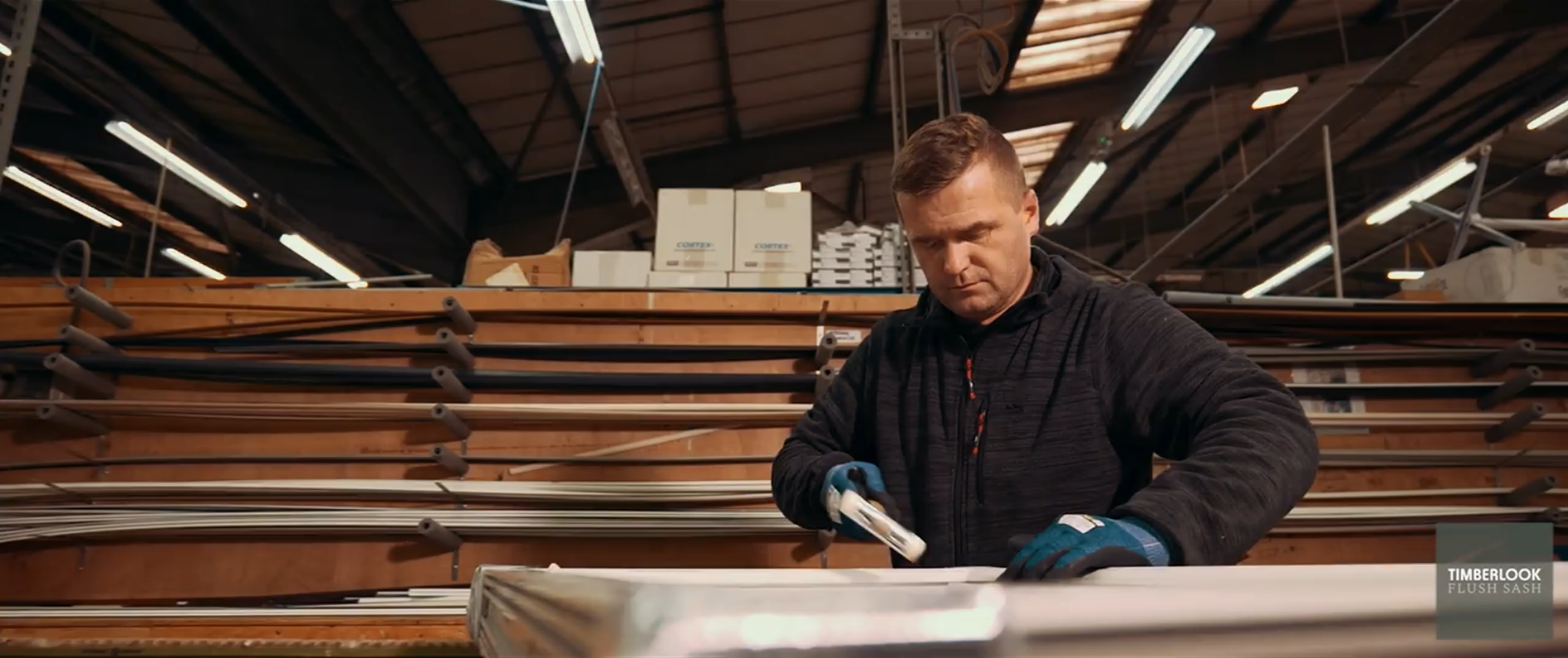 Man preparing window in warehouse