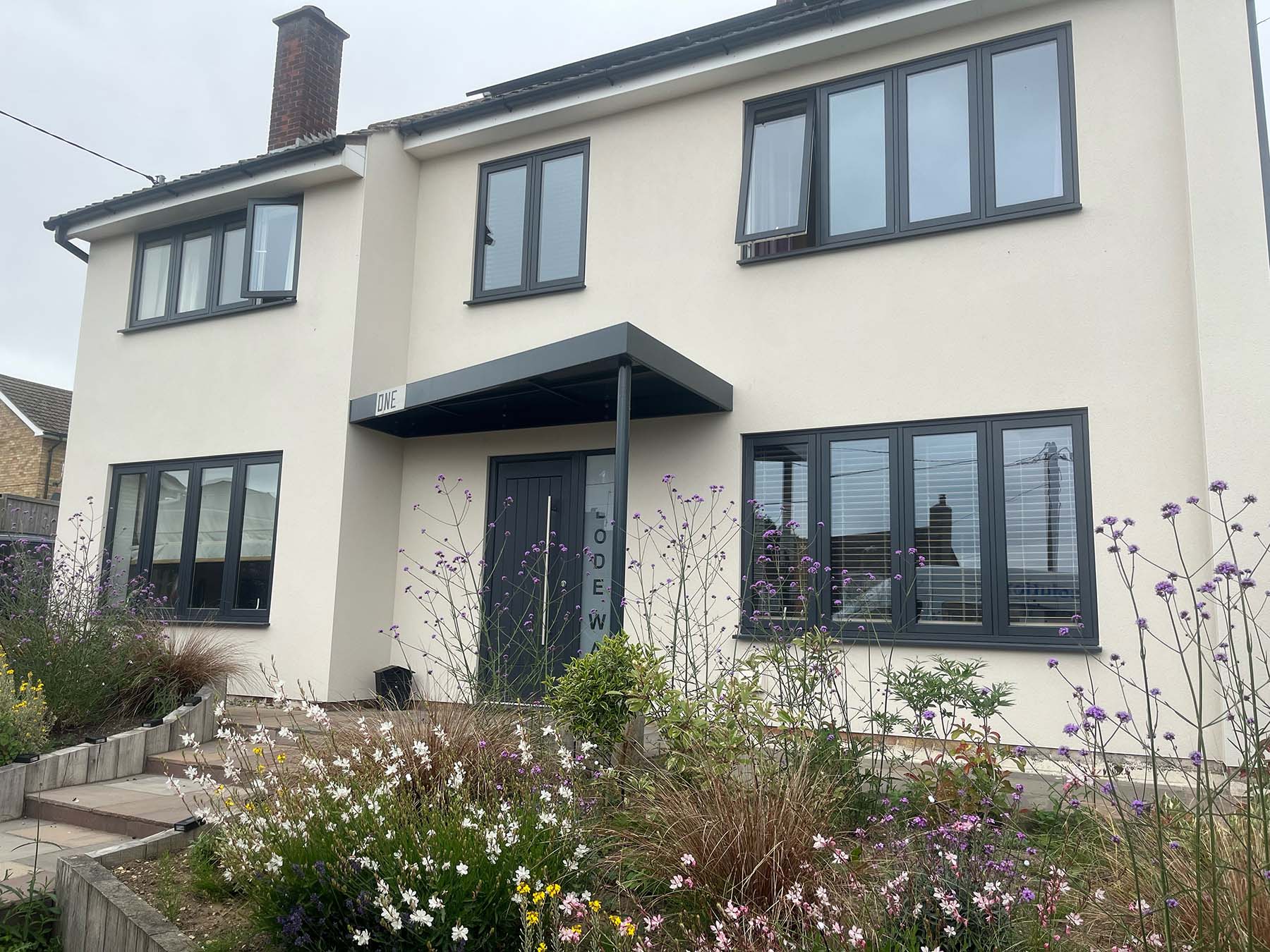 full house black flush sash windows and front door
